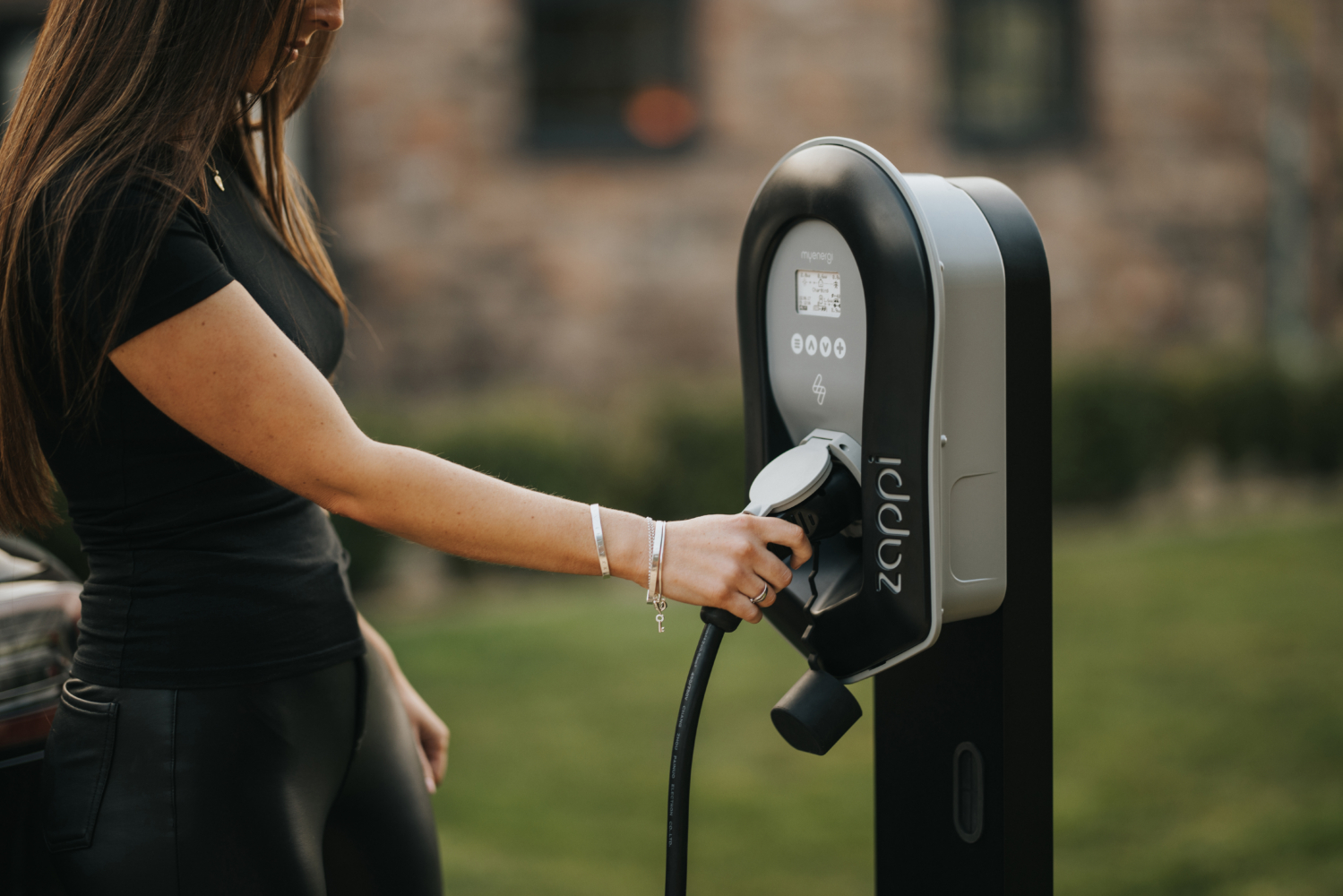 woman using a zappi home EV charger