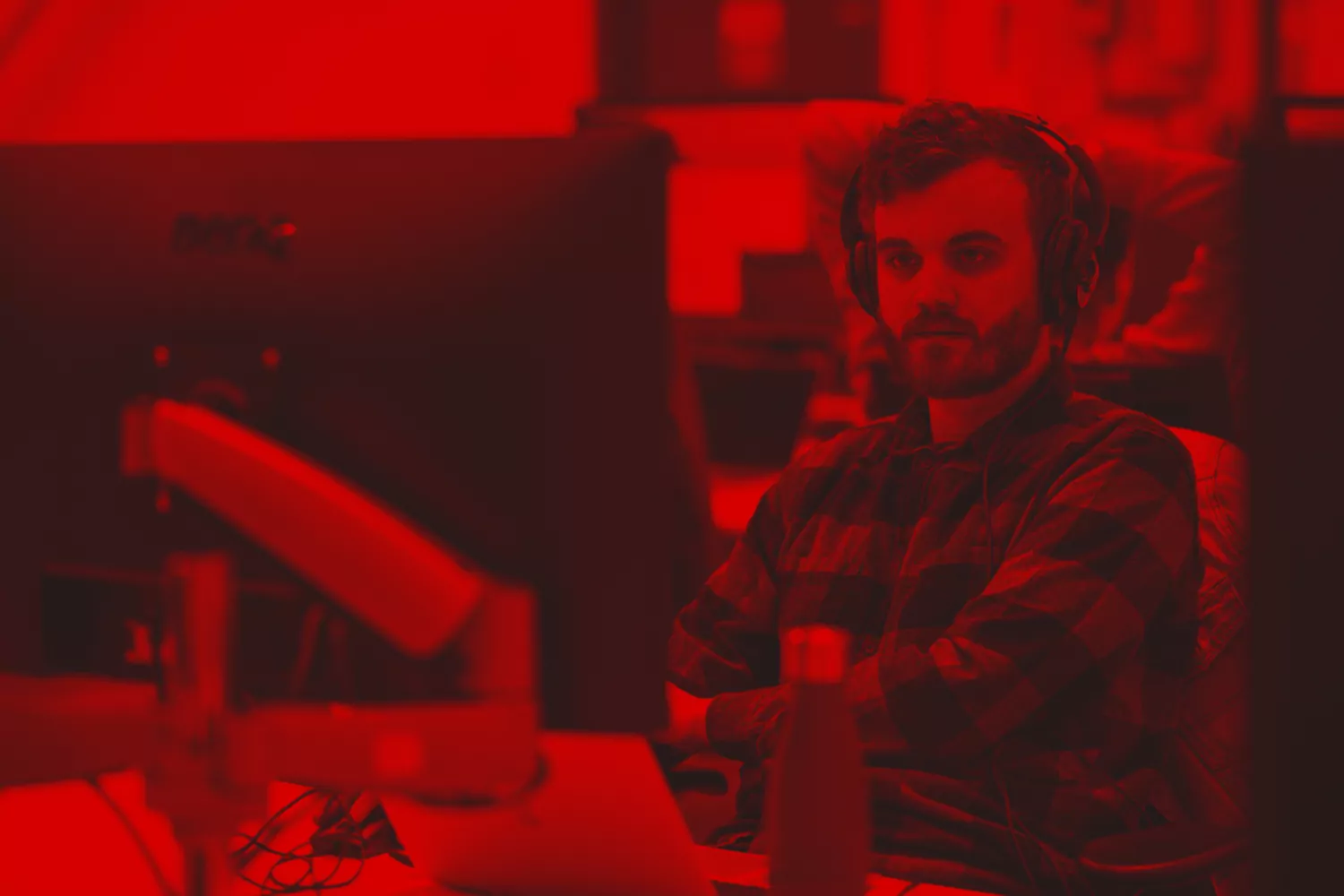 Ben with headphones on attending a digital meeting about performance optimisation