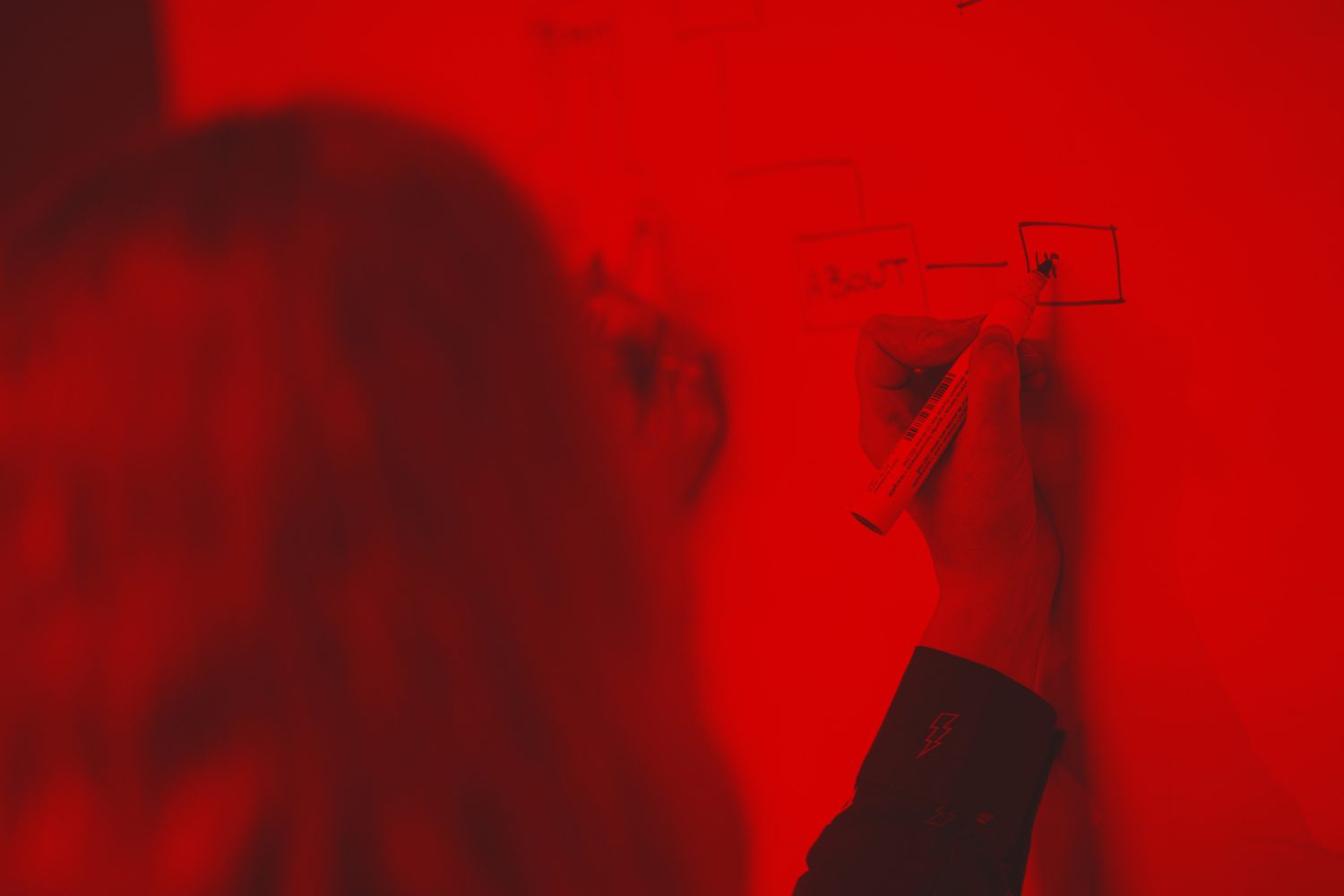 close up of a diagram being drawn on a whiteboard by Charlotte