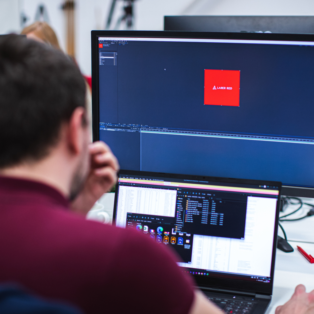 one of our designers working hard on website design | laser red