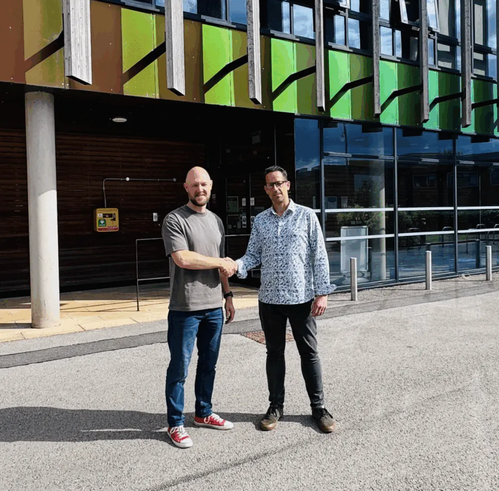 Liam Oleary and Nick Whyatt shaking hands outside the ThinkTank office