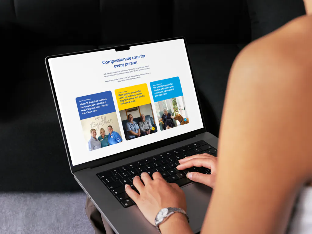 A mock up of the st barnabas website being used on a laptop